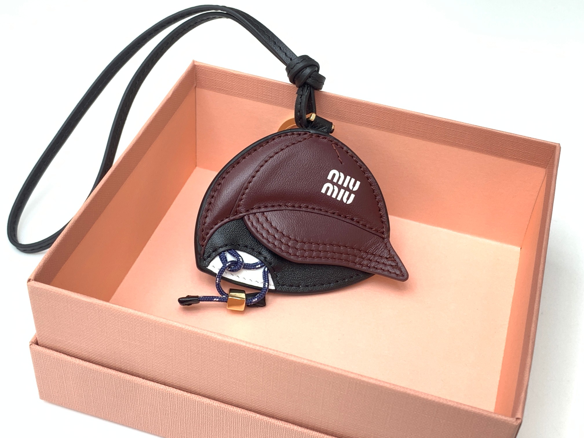 Bagsaaa Miu Miu baseball-cap leather bag charm
